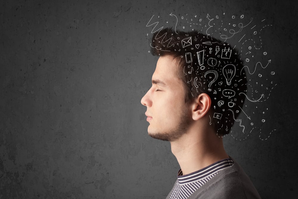 Young man thinking with white abstract lines and symbols